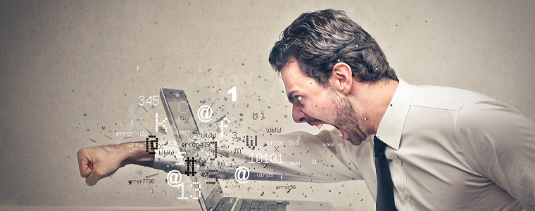 frustrated man punching through screen