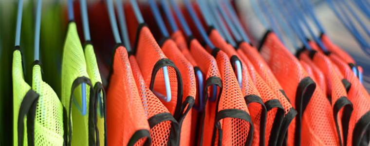 orange and yellow safety vests