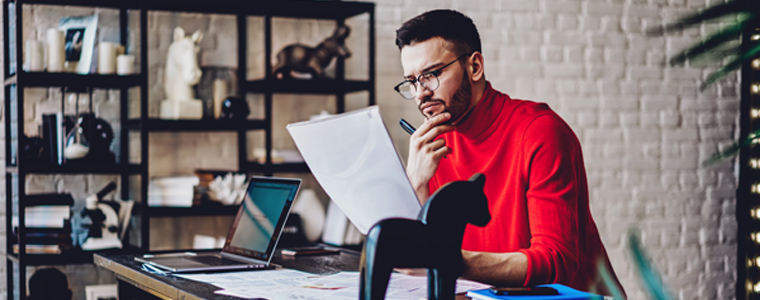 man reading freight invoice