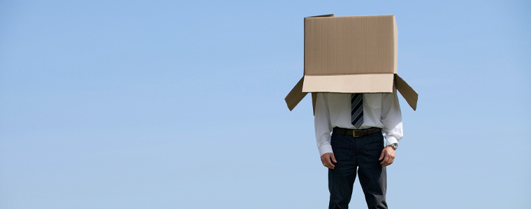 businessman with box on head