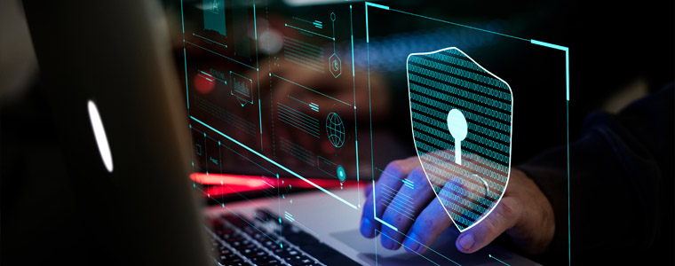 man on laptop cyber security