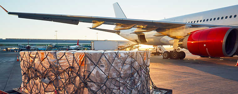 Shipment on pallet being prepared to load on airplane