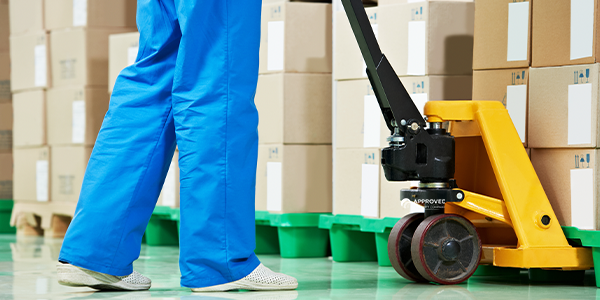 person transports medical supplies on a pallet