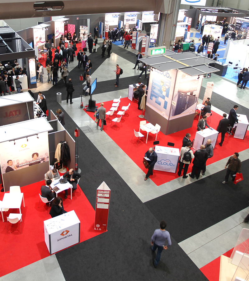 People visit exhibition area at tradeshow from above