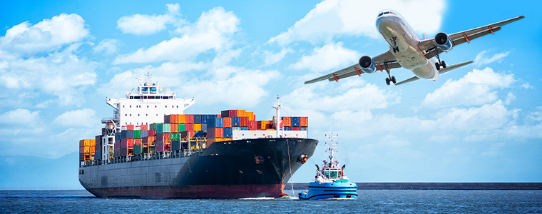 plane flying over cargo ship