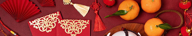 Chinese new year festival decoration. Traditional lunar new year flat lay with green tea, red paper fans, cherry blossom.