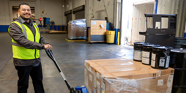 working moving boxes with hand cart