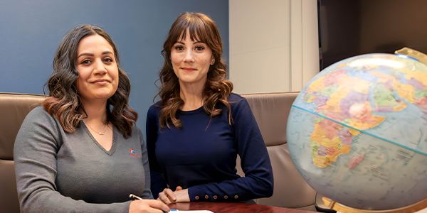 managers working with globe on the desk