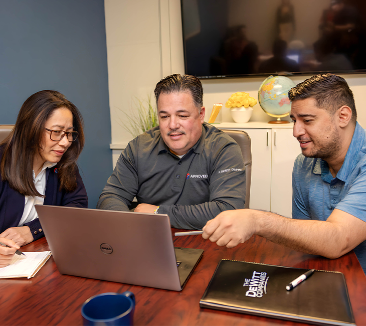 logistics managers working on a laptop project