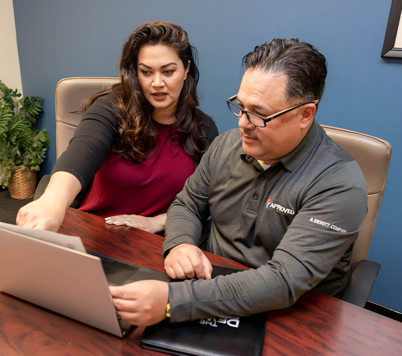 project managers working on a laptop