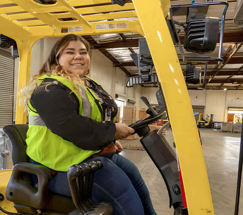 warehouse manager driving forklift